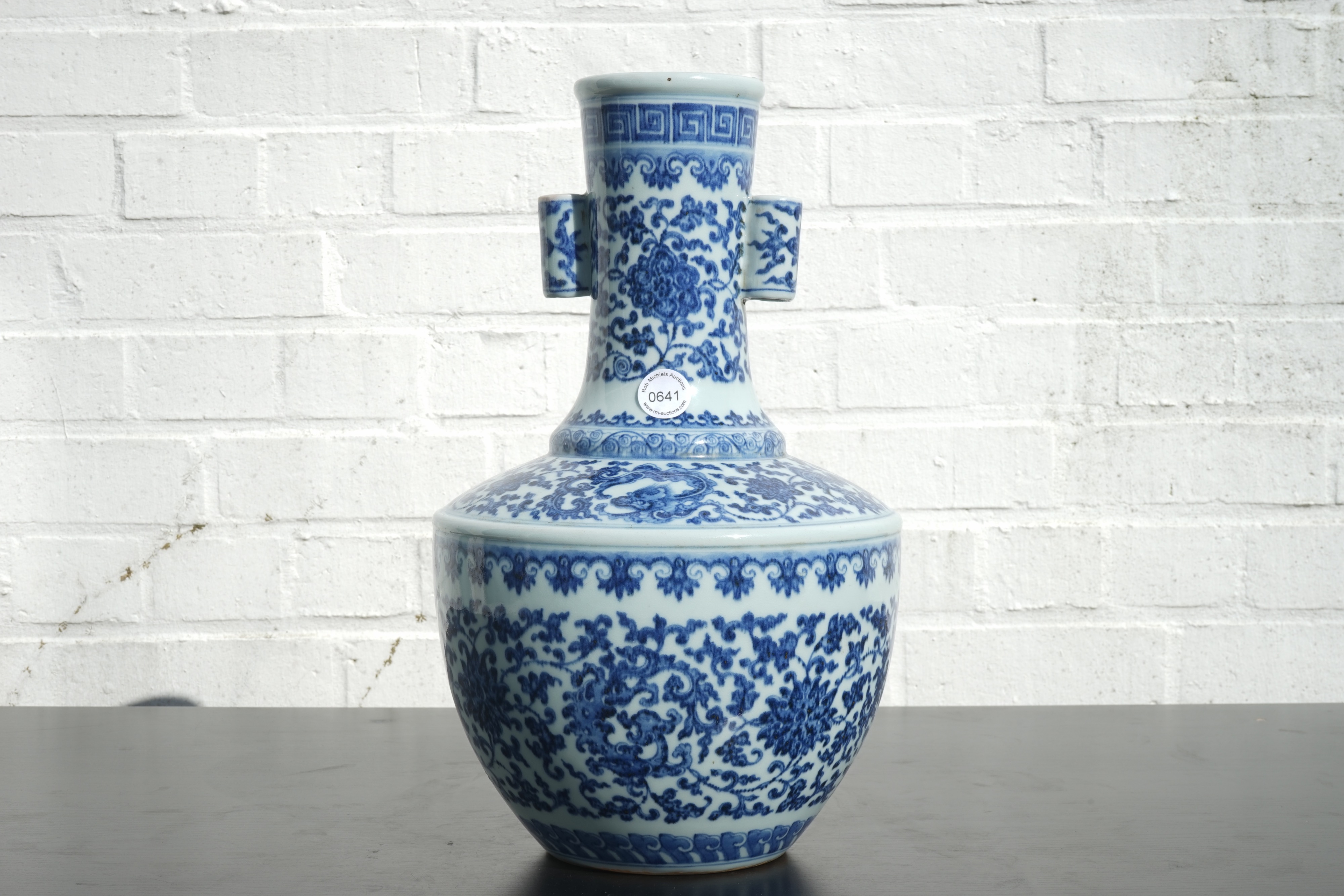 A Chinese Blue And White Ming Style Porcelain Arrow Vase With Lotus