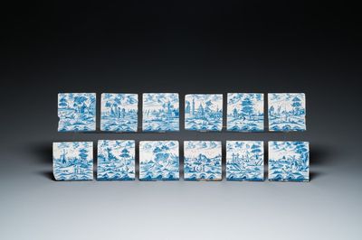 12 carreaux en faïence de Delft en bleu et blanc à décor de paysages, 18ème