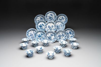 12 Chinese blue and white cups and 11 saucers with birds among flowering branches, Kangxi