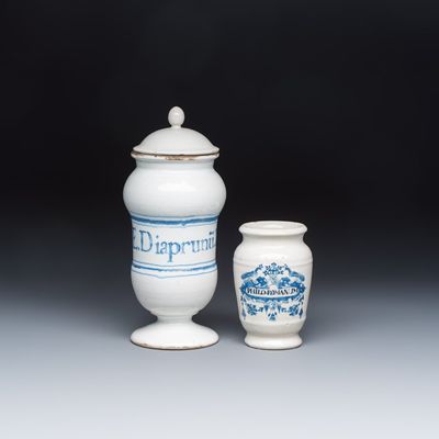 A blue and white Dutch Delft apothecary jar inscribed 'PHILO. ROMANUM' and a French apothecary jar and cover, 18/19th C.