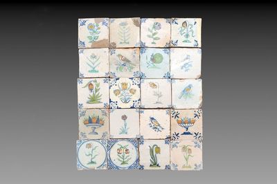 20 polychrome Dutch Delft tiles with birds, flowers and fruit bowls, 17th C.
