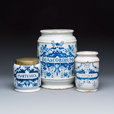 A varied group of three Dutch Delft and Brussels faience apothecary jars, 18/19th C.