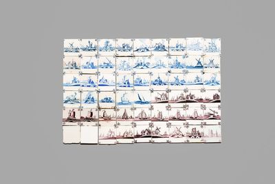 54 blue, white and manganese Dutch Delft tiles, 18th C.