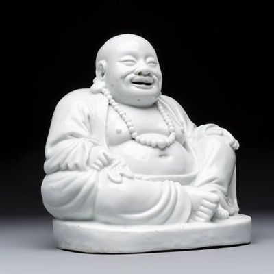 A Chinese Dehua blanc de Chine Milefo Buddha, 19th C.