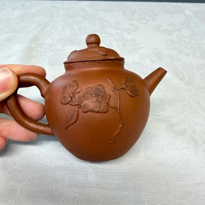 A Chinese Yixing stoneware teapot and cover with floral relief design — photo 4