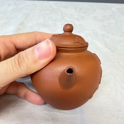 A Chinese Yixing stoneware teapot and cover with floral relief design — photo 5