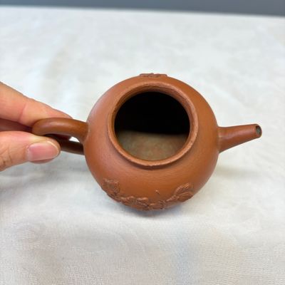A Chinese Yixing stoneware teapot and cover with floral relief design — photo 6