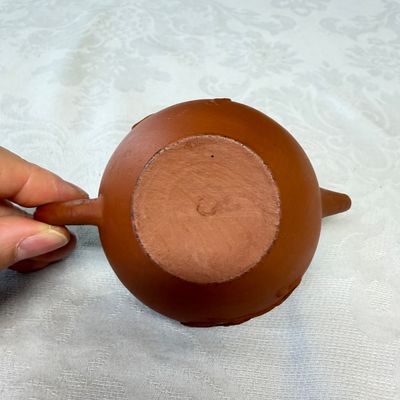 A Chinese Yixing stoneware teapot and cover with floral relief design — photo 8