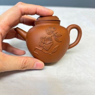 A Chinese Yixing stoneware teapot and cover with floral relief design — photo 2