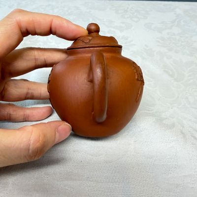 A Chinese Yixing stoneware teapot and cover with floral relief design — photo 3