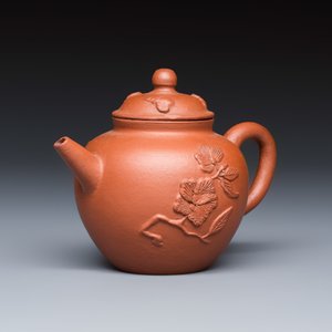 A Chinese Yixing stoneware teapot and cover with floral relief design — photo 1