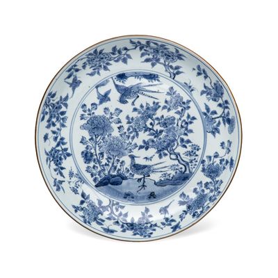 A  Chinese blue and white 'Birds among Blossoms' dish, Transitional period