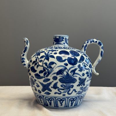 A Chinese blue and white 'Flowers and Auspicious Emblems' ewer — photo 1