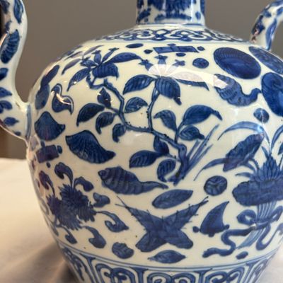 A Chinese blue and white 'Flowers and Auspicious Emblems' ewer — photo 2