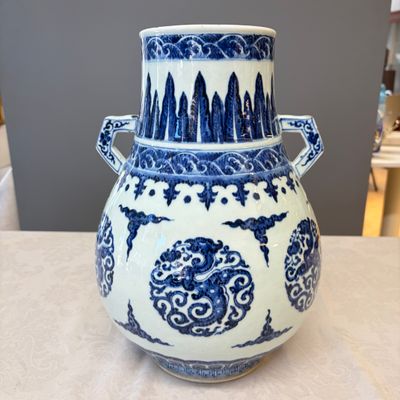 A Chinese blue and white 'Hu' vase with phoenix medallions — photo 1