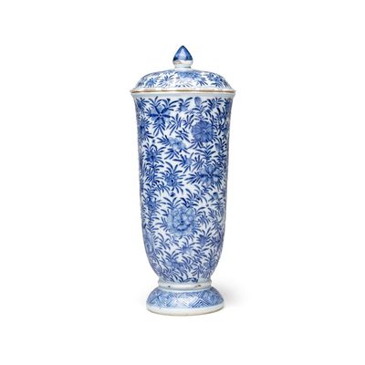 A Chinese blue and white beaker and cover with floral design, Kangxi