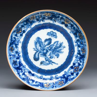 A Chinese blue and white gilt-decorated 'Botanical' plate based on designs by the German botanist Maria Sybille Merian, Qianlong, ca. 1740