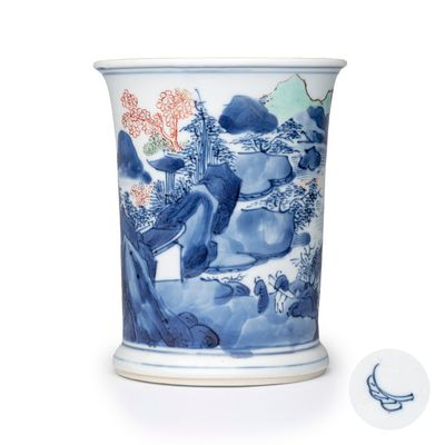 A Chinese blue and white, iron-red-decorated and green-enamelled 'Mountainous Riverscape'  brushpot (Bitong), artemisia leaf mark, Kangxi