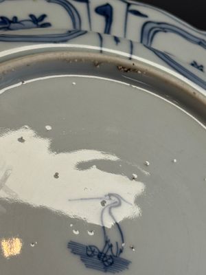 A Chinese blue and white plate with birds in a landscape — photo 17