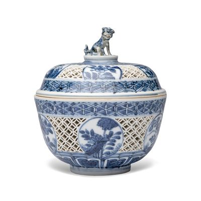 A Chinese blue and white reticulated 'Linglong' bowl and cover, Transitional period