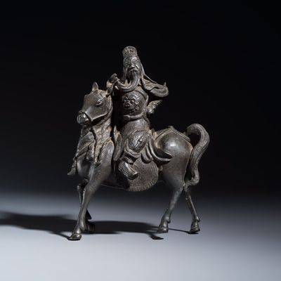 A Chinese bronze model of Guandi on horseback, Ming