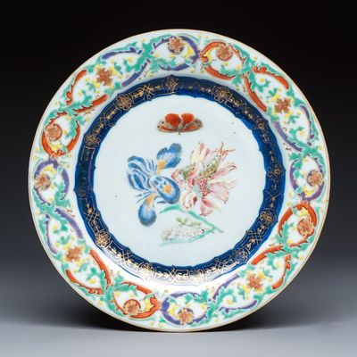 A Chinese famille rose 'Botanical' plate based on designs by the German botanist Maria Sybille Merian, Qianlong, ca. 1740