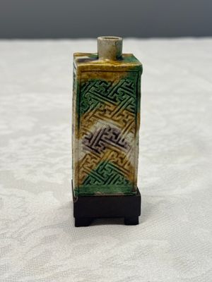 A Chinese famille verte sancai biscuit 'Crab' water pot and a 'Swastika' square bottle on a later wooden stand — photo 2