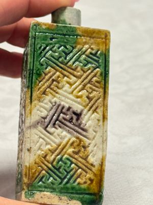 A Chinese famille verte sancai biscuit 'Crab' water pot and a 'Swastika' square bottle on a later wooden stand — photo 6