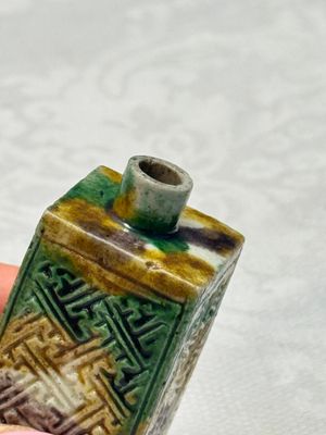 A Chinese famille verte sancai biscuit 'Crab' water pot and a 'Swastika' square bottle on a later wooden stand — photo 9