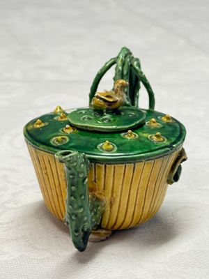 A Chinese famille verte sancai biscuit 'Lotus' teapot on a later wooden stand — photo 2