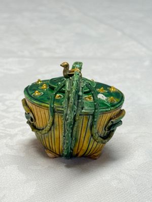 A Chinese famille verte sancai biscuit 'Lotus' teapot on a later wooden stand — photo 4