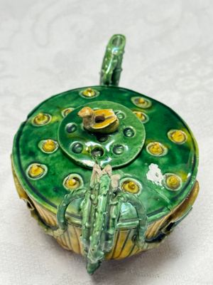 A Chinese famille verte sancai biscuit 'Lotus' teapot on a later wooden stand — photo 5
