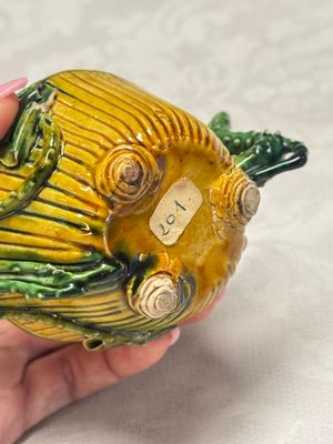 A Chinese famille verte sancai biscuit 'Lotus' teapot on a later wooden stand — photo 8