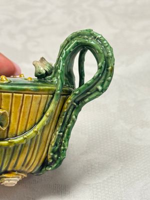 A Chinese famille verte sancai biscuit 'Lotus' teapot on a later wooden stand — photo 10