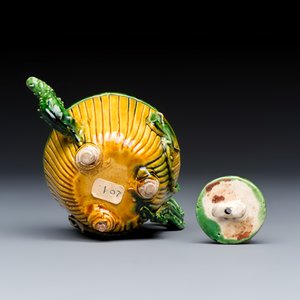 A Chinese famille verte sancai biscuit 'Lotus' teapot on a later wooden stand — photo 7