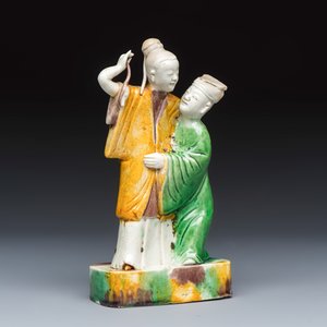 A Chinese famille verte sancai biscuit group of a man embracing a lady — photo 1