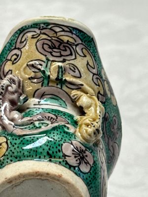 A Chinese famille verte sancai biscuit libation cup and a model of a shoe — photo 19