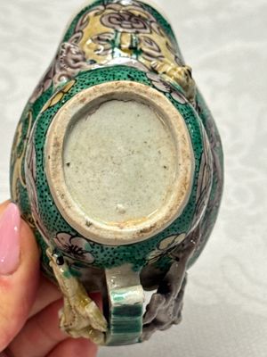 A Chinese famille verte sancai biscuit libation cup and a model of a shoe — photo 24