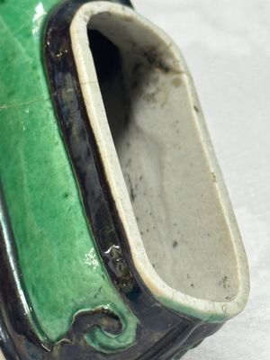 A Chinese famille verte sancai biscuit libation cup and a model of a shoe — photo 9