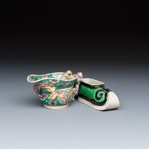 A Chinese famille verte sancai biscuit libation cup and a model of a shoe — photo 1
