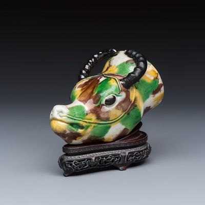 A Chinese famille verte sancai biscuit rhyton or libation cup in the shape of a buffalo head, Kangxi