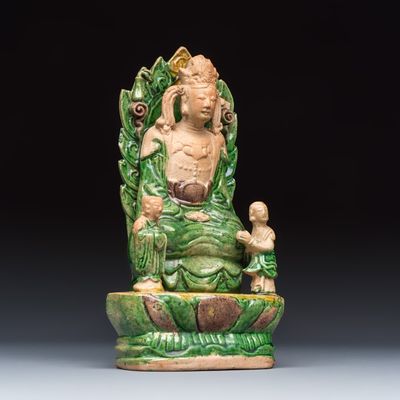 A Chinese sancai-glazed stoneware group of Guanyin and two attendants, Ming