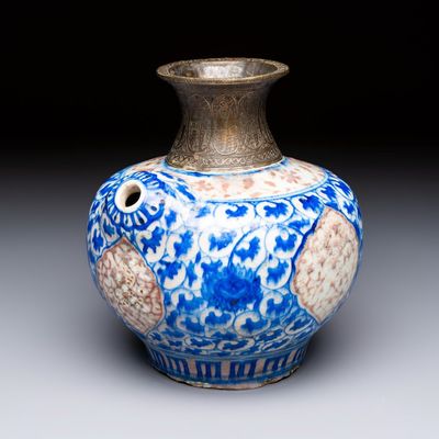 A Safavid blue, white and red pottery hookah base or kendi, Kirman, Persia, 17th C.