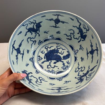A blue and white Chinese 'Qilin and Flying Horses' bowl — photo 1