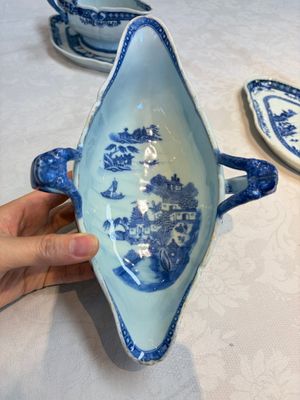 A pair of Chinese blue and white handled sauce boats and stands with pagodas along a river — photo 12