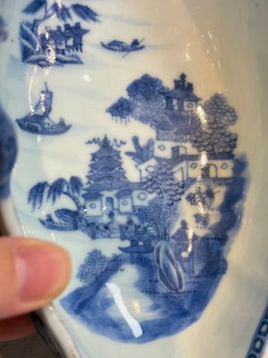 A pair of Chinese blue and white handled sauce boats and stands with pagodas along a river — photo 13