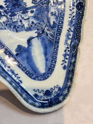 A pair of Chinese blue and white handled sauce boats and stands with pagodas along a river — photo 18
