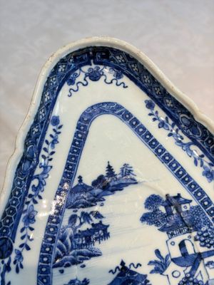 A pair of Chinese blue and white handled sauce boats and stands with pagodas along a river — photo 19