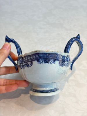 A pair of Chinese blue and white handled sauce boats and stands with pagodas along a river — photo 8