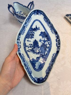 A pair of Chinese blue and white handled sauce boats and stands with pagodas along a river — photo 9